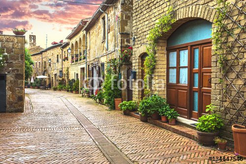 Flower filled streets of the old Italian city in Tuscany. - 901150552