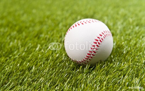 Baseball on the fake green grass