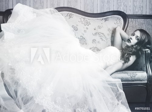 beautiful bride on a retro couch. Black and white - 901145356