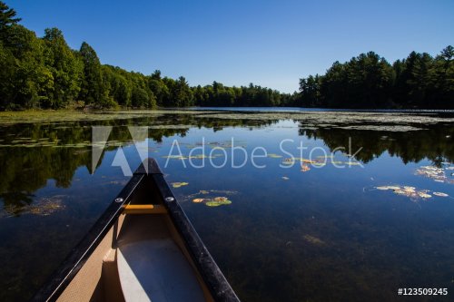 Canoe on lake with still water