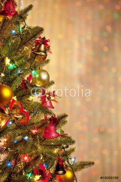 Christmas fir tree with colorful lights close up