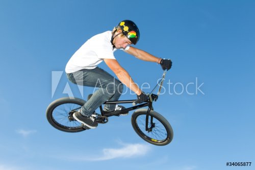 Freestyle BMX rider getting air