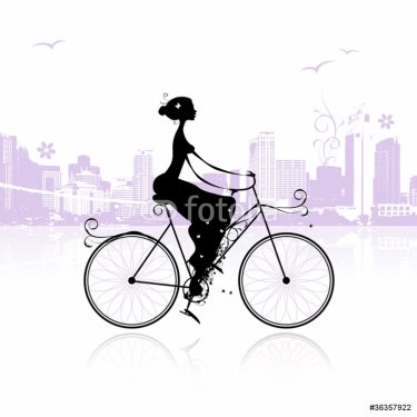 Girl cycling in the city - 900459091