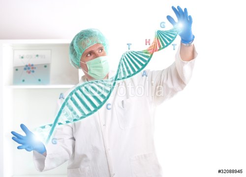 Researcher holding up a DNA strand in the laboratory - 900391416