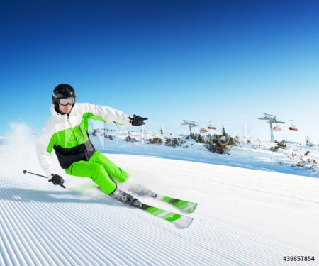 Skier in mountains, prepared piste and sunny day - 900121756