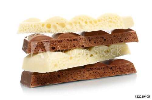 Stack of brown and white porous chocolate - 900673756
