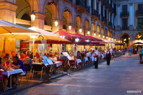 Street restaurants at Placa Reial in  night. Barcelona