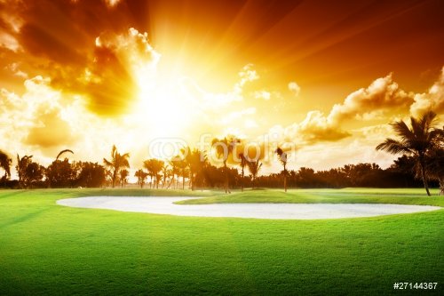 sunset on golf field - 900643884