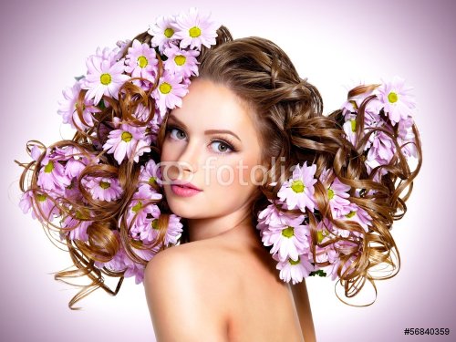 Young beautiful woman with flowers in hairs - 901143659