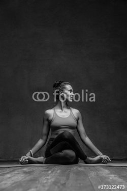 Young beautiful yoga female posing in studio - 901151120