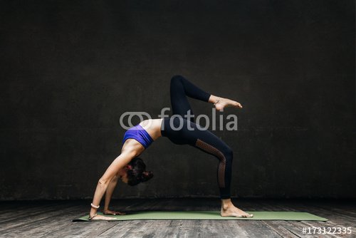 Young beautiful yoga female posing in studio - 901151121