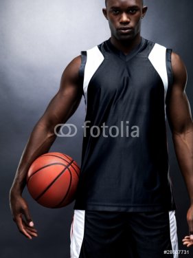 Young black basketball player with baskeball