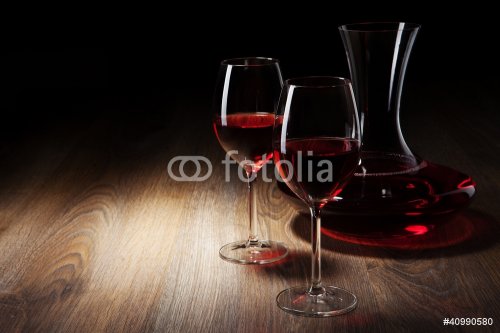 two Wine glass and decanter on a wooden table - 900437786