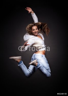 attractive young woman dancing, hair flying