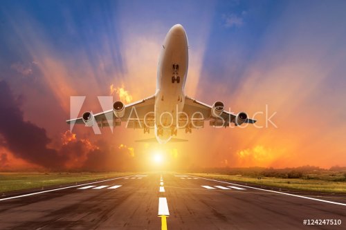 Airplane flying take off from runway on sunset - 901155233