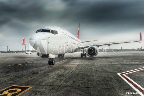 Airplane ready for boarding in a airport hub. - 901155219