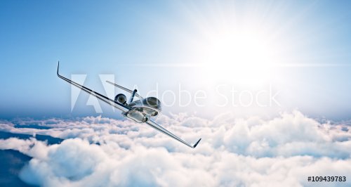 Concept of black luxury generic design private jet flying in blue sky at sunset.