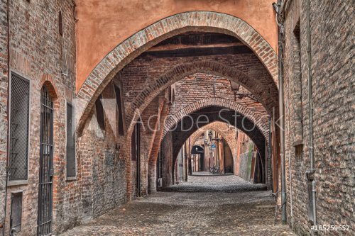 Ferrara, Italy: the medieval alley Via delle Volte - 901155457