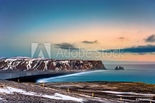 Reynisfjara beach and Reynisdrangar rock formation under the mountain Reynisfjall near the village Vik in Iceland