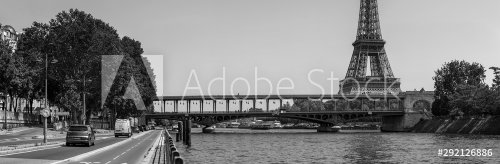 Panoramic black and white view of the Eiffel tower, metro bridge close to the... - 901155730