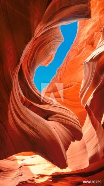 Up to blue sky in slot canyon. The Magic Antelope Canyon in the Navajo Reservation, Arizona