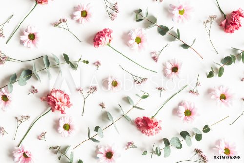Flowers composition. Pattern made of pink flowers and eucalyptus branches on white background.