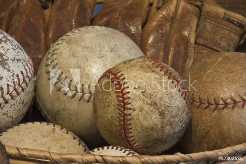 A Basket of Old Baseballs with an Antique Glove