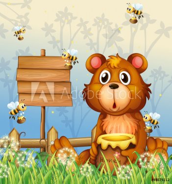 A bear and bees near a signage