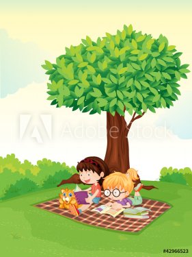 a boy and girl studying under tree.