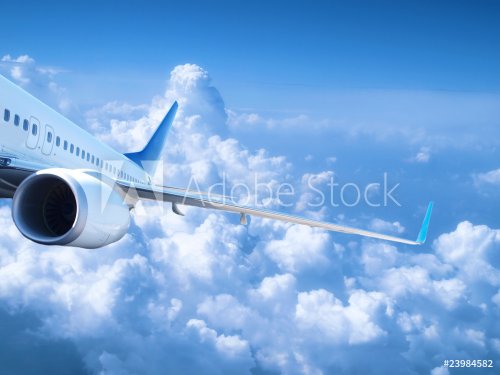 Airplane above the clouds - 901146770