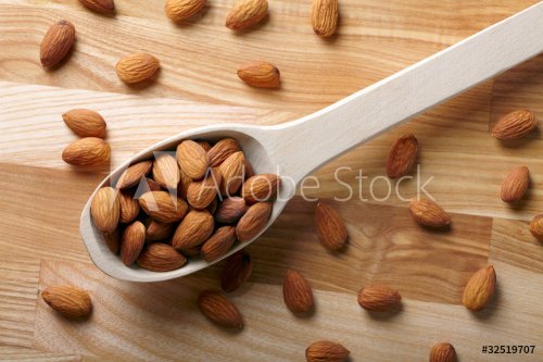Almonds on wooden background - 900673680