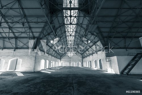 an empty desolate industrial building inside - 901144023