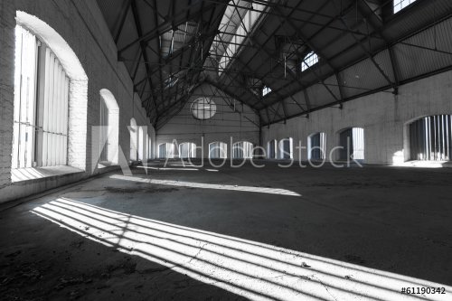 an empty desolate industrial building inside - 901144026
