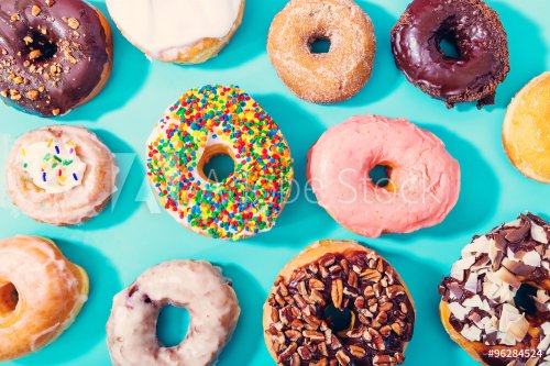 Assorted donuts on pastel blue background - 901152425