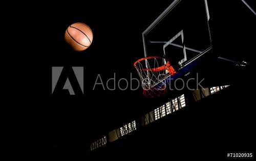 Basketball on  black background with light effect - 901148407