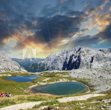 Beautiful lakes and peaks of Dolomites. Summer sunset over Alps - 901140512