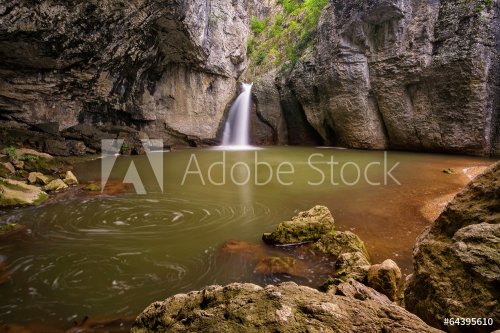 Beautiful waterfall among cliffs