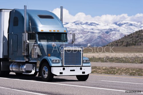 Big classic semi truck on mountains background