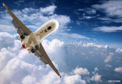 Big jet airplane flying above clouds - 901146773