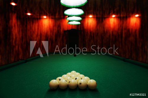 billiard balls on green baize in the game of pyramid - 901149629