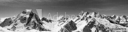 Black and white panoramic view of snow-capped mountain peaks