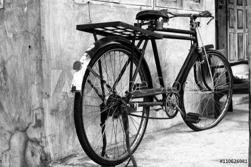 Black and white photo of vintage bicycle - film grain filter effect styles - 901153415