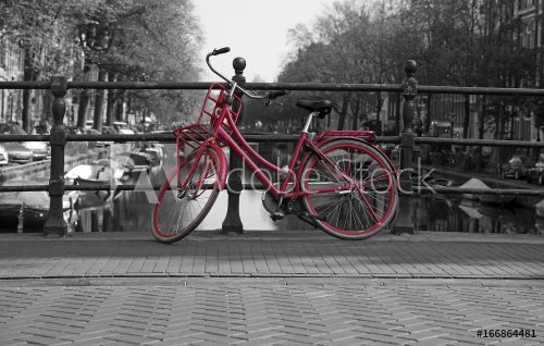 Black and white view of Amsterdam with redbicycle - 901152860