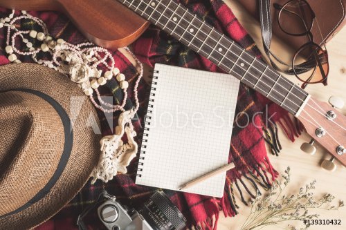 Blank notebook with ukulele and vacation stuff