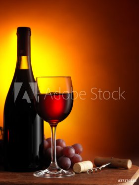 Bottle and glass of red wine - 900634840