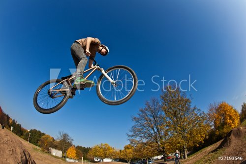 boy going airborne with a dirt  bike