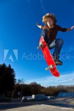 boy going airborne with his skateboard - 900331115