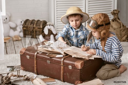 Boys in images traveler and pilot play in his room - 901144116