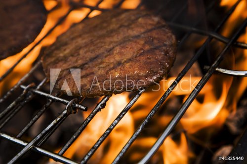 Burgers on grill in fire! - 900425660