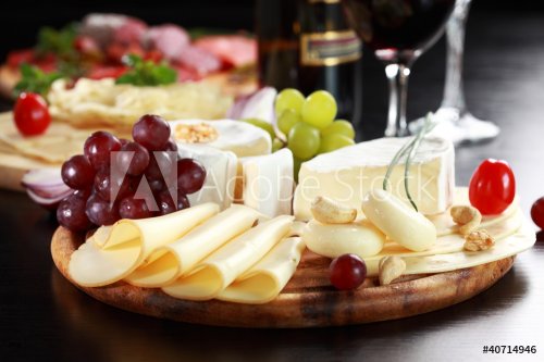 Cheese and salami platter with herbs